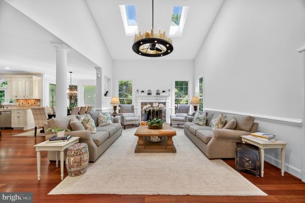 Chandelier, Dining room, Fireplace, Interior, Living room, Pendant Lights, Recessed Lighting, Wood Texture Flooring