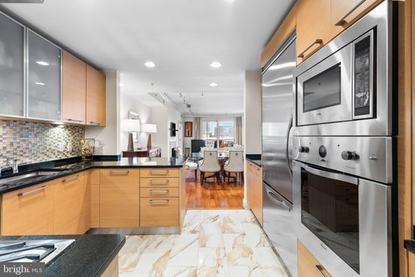 Dining room, Interior, Kitchen, Marble, Recessed Lighting, Stainless Steel Appliances, Wood Texture Flooring