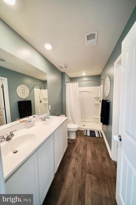 Bathroom, Dual Sink Vanities, Interior, Recessed Lighting, Wood Texture Flooring