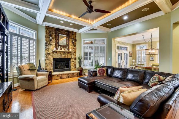Fireplace, Interior, Living room, Pendant Lights, Recessed Lighting, Stone Walls, Wood Texture Flooring