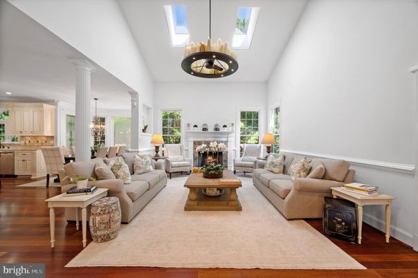 Chandelier, Dining room, Fireplace, Interior, Living room, Pendant Lights, Recessed Lighting, Wood Texture Flooring