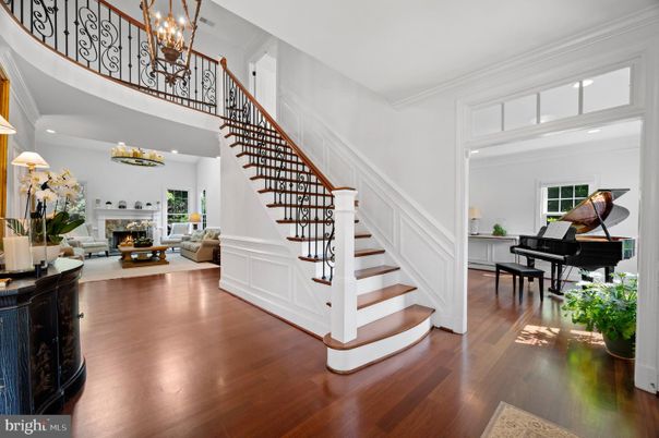 Chandelier, Fireplace, Interior, Living room, Piano, Recessed Lighting, Wood Texture Flooring