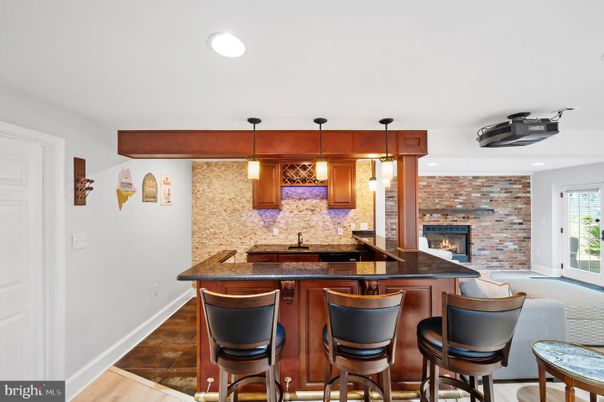 Fireplace, Interior, Pendant Lights, Recessed Lighting, Stone Walls, Wood Texture Flooring