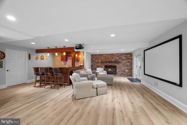 Fireplace, Interior, Living room, Pendant Lights, Recessed Lighting, Stone Walls, Wood Texture Flooring