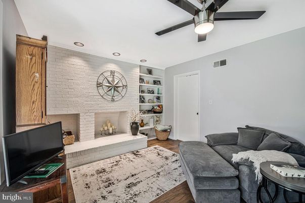 Fireplace, Interior, Living room, Recessed Lighting, Stone Walls, Wood Texture Flooring