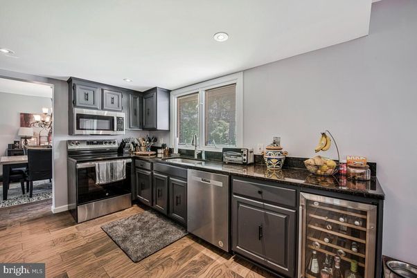 Chandelier, Dining room, Interior, Kitchen, Recessed Lighting, Stainless Steel Appliances, Wood Texture Flooring