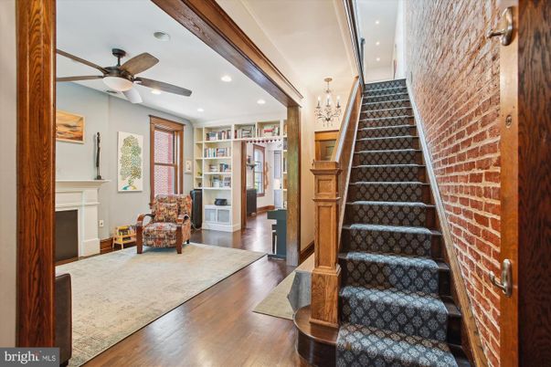 Chandelier, Fireplace, Interior, Recessed Lighting, Stone Walls, Wood Texture Flooring