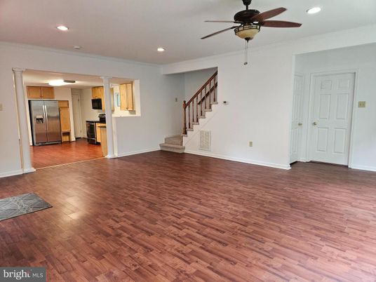 Empty room, Interior, Kitchen, Recessed Lighting, Stainless Steel Appliances, Wood Texture Flooring