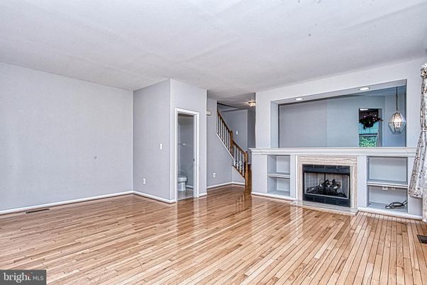 Empty room, Fireplace, Interior, Pendant Lights, Recessed Lighting, Wood Texture Flooring