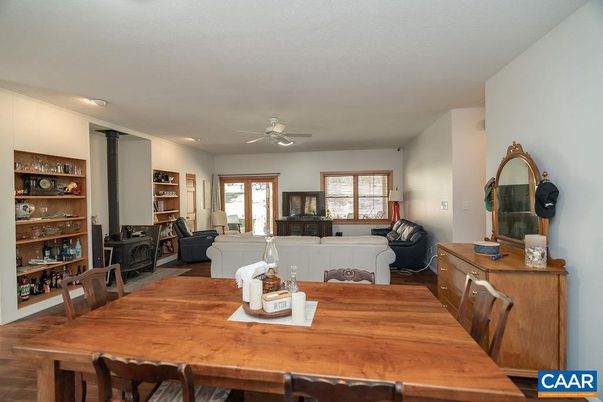 Dining room, Fireplace, Interior, Living room, Recessed Lighting, Wood Texture Flooring