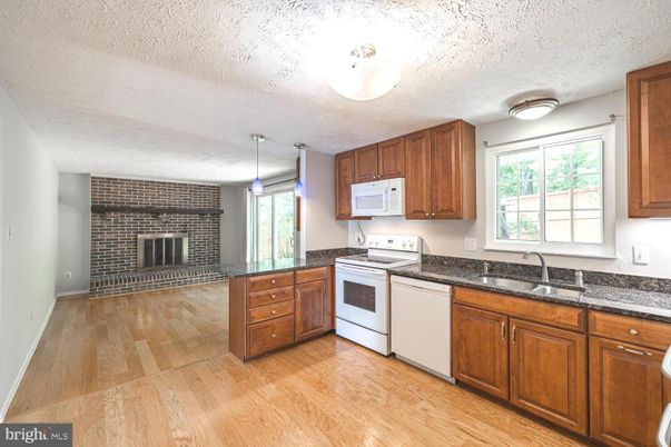 Fireplace, Interior, Kitchen, Pendant Lights, Stone Walls, Wood Texture Flooring