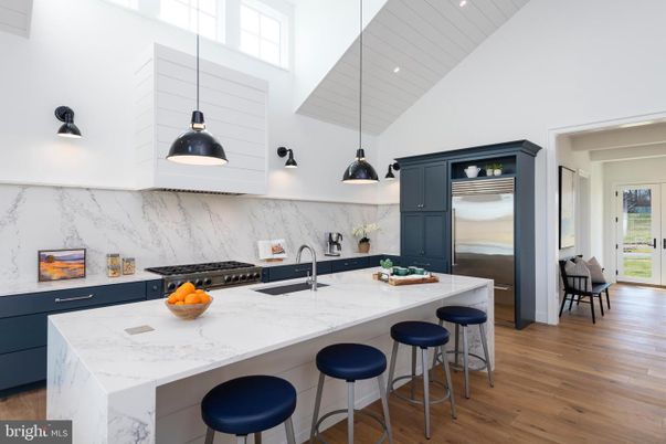 Interior, Kitchen, Marble Walls, Pendant Lights, Recessed Lighting, Stainless Steel Appliances, Wood Texture Flooring