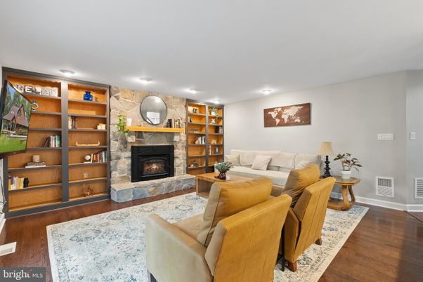 Fireplace, Interior, Living room, Recessed Lighting, Stone Walls, Wood Texture Flooring