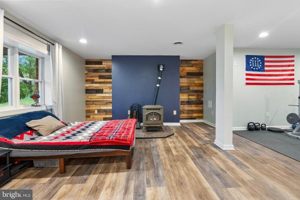Fireplace, Fitness Equipment, Interior, Recessed Lighting, Wood Texture Flooring, Wooden Walls