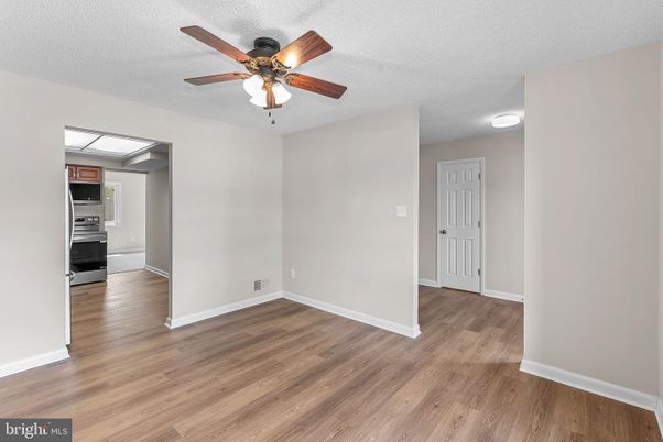 Empty room, Interior, Kitchen, Stainless Steel Appliances, Wood Texture Flooring