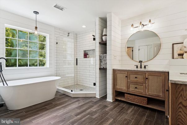 Bathroom, Free Standing Baths, Glass Shower, Interior, Pendant Lights, Recessed Lighting, Wood Texture Flooring