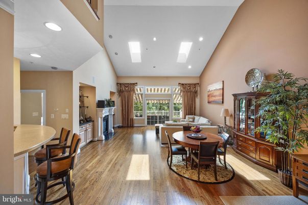 Dining room, Fireplace, Interior, Living room, Recessed Lighting, Wood Texture Flooring