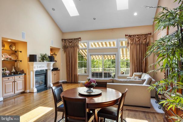 Dining room, Fireplace, Interior, Living room, Recessed Lighting, Wood Texture Flooring