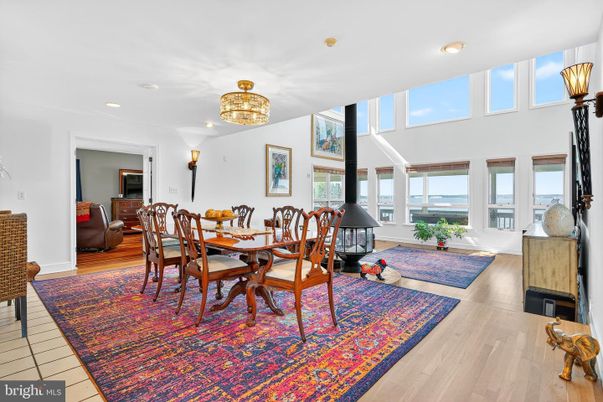 Dining room, Interior, Piano, Recessed Lighting, Water, Wood Texture Flooring