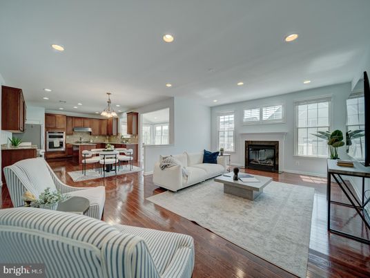 Chandelier, Dining room, Fireplace, Interior, Kitchen, Living room, Pendant Lights, Recessed Lighting, Stainless Steel Appliances, Wood Texture Flooring