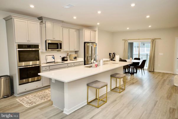 Dining room, Interior, Kitchen, Recessed Lighting, Stainless Steel Appliances, Wood Texture Flooring