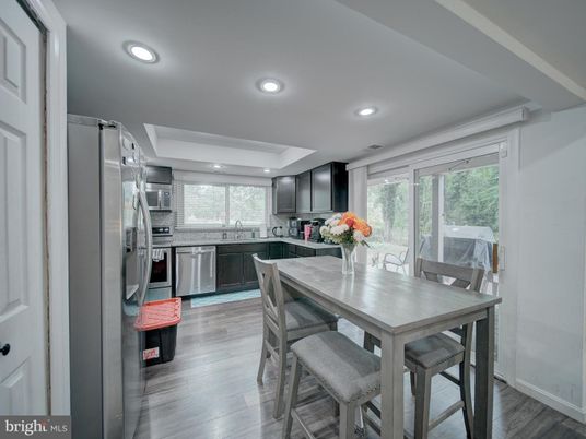 Dining room, Interior, Kitchen, Recessed Lighting, Stainless Steel Appliances, Wood Texture Flooring