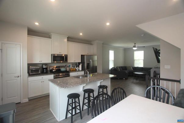 Dining room, Interior, Kitchen, Living room, Recessed Lighting, Stainless Steel Appliances, Wood Texture Flooring