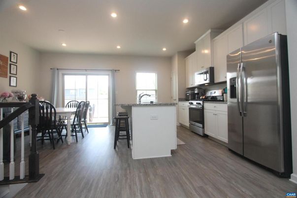 Dining room, Interior, Kitchen, Recessed Lighting, Stainless Steel Appliances, Wood Texture Flooring