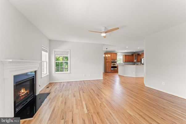 Empty room, Fireplace, Interior, Kitchen, Pendant Lights, Recessed Lighting, Wood Texture Flooring