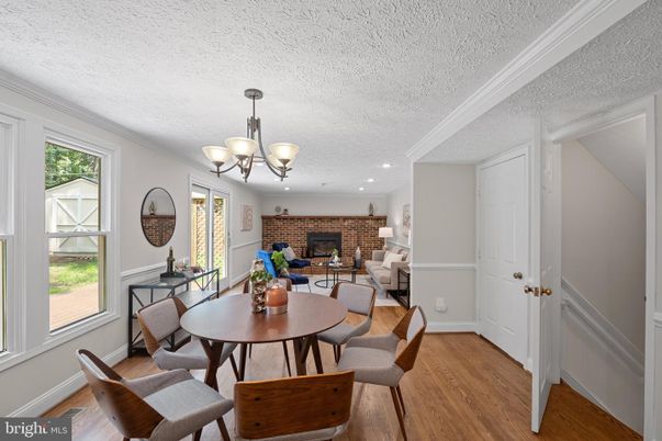 Chandelier, Dining room, Fireplace, Interior, Recessed Lighting, Stone Walls, Wood Texture Flooring