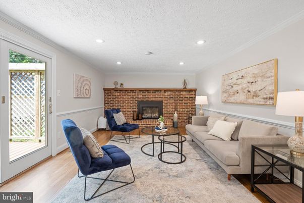 Fireplace, Interior, Living room, Recessed Lighting, Stone Walls, Wood Texture Flooring