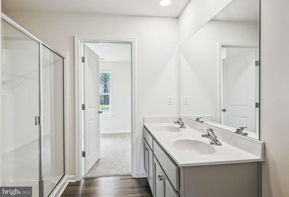 Bathroom, Dual Sink Vanities, Glass Shower, Interior, Recessed Lighting, Wood Texture Flooring