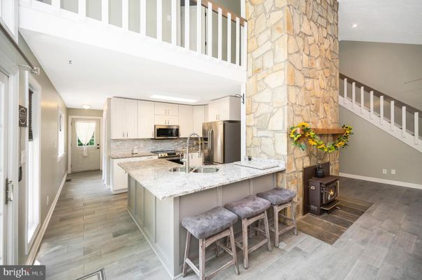 Interior, Kitchen, Recessed Lighting, Stainless Steel Appliances, Stone Walls, Wood Texture Flooring
