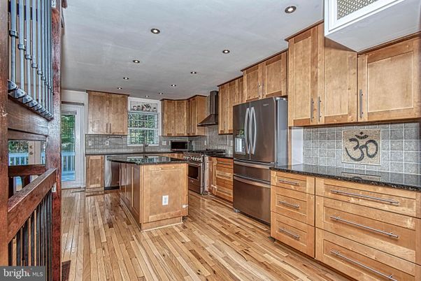 Interior, Kitchen, Recessed Lighting, Tile Countertops, Wood Texture Flooring