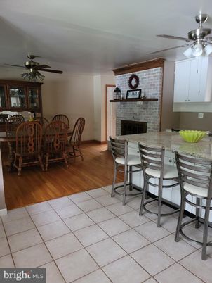 Dining room, Fireplace, Interior, Stone Walls, Wood Texture Flooring
