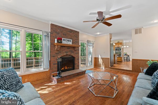 Fireplace, Interior, Kitchen, Living room, Recessed Lighting, Stainless Steel Appliances, Stone Walls, Wood Texture Flooring