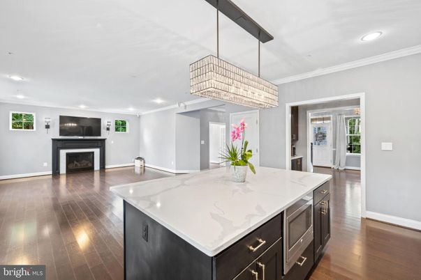 Chandelier, Fireplace, Interior, Kitchen, Recessed Lighting, Wood Texture Flooring