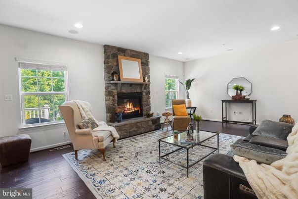 Fireplace, Interior, Living room, Recessed Lighting, Stone Walls, Wood Texture Flooring