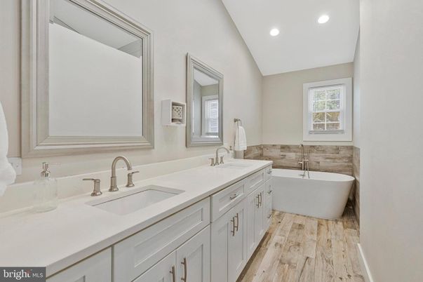 Bathroom, Dual Sink Vanities, Free Standing Baths, Interior, Recessed Lighting, Wood Texture Flooring