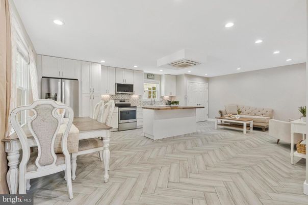 Dining room, Interior, Kitchen, Recessed Lighting, Stainless Steel Appliances, Wood Texture Flooring