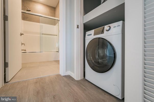 Bathroom, Interior, Recessed Lighting, Utility Closets, Washer, Wood Texture Flooring