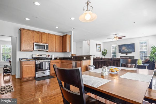 Dining room, Interior, Kitchen, Living room, Pendant Lights, Recessed Lighting, Stainless Steel Appliances, Wood Texture Flooring