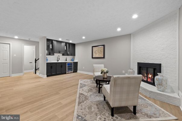 Fireplace, Interior, Kitchen, Living room, Recessed Lighting, Stone Walls, Wood Texture Flooring