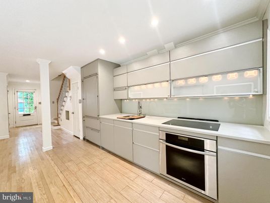 Interior, Kitchen, Recessed Lighting, Stainless Steel Appliances, Washer, Wood Texture Flooring