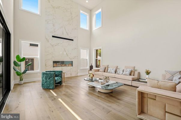 Fireplace, Interior, Living room, Marble Walls, Recessed Lighting, Wood Texture Flooring