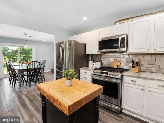 Dining room, Interior, Kitchen, Pendant Lights, Recessed Lighting, Stainless Steel Appliances, Wood Texture Flooring
