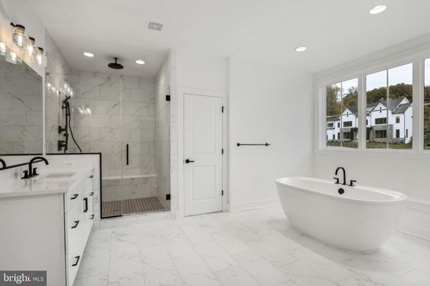 Bathroom, Dual Sink Vanities, Free Standing Baths, Glass Shower, Interior, Marble, Marble Walls, Recessed Lighting