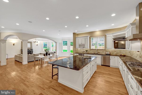 Chandelier, Dining room, Interior, Kitchen, Living room, Recessed Lighting, Stainless Steel Appliances, Wood Texture Flooring
