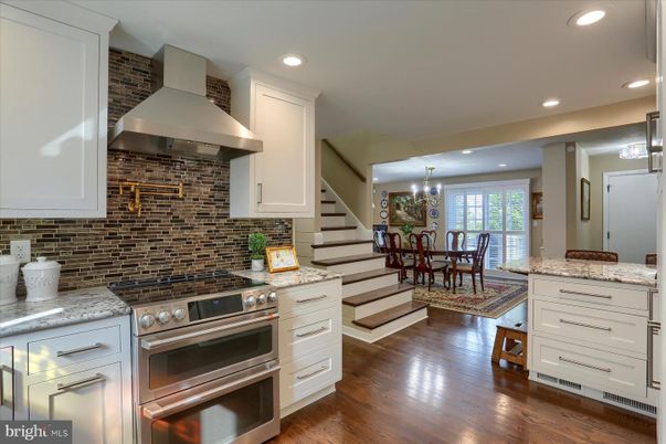 Chandelier, Dining room, Interior, Kitchen, Recessed Lighting, Stainless Steel Appliances, Wood Texture Flooring
