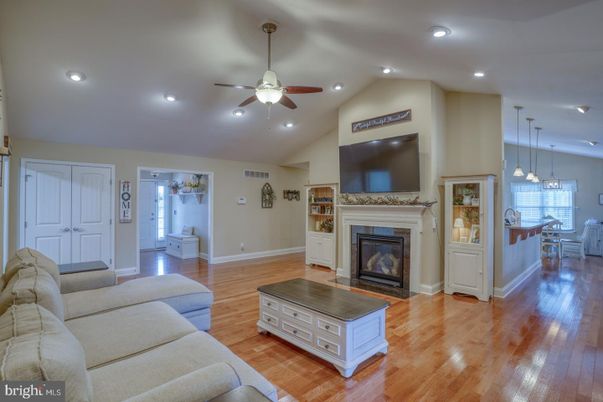 Dining room, Fireplace, Interior, Living room, Pendant Lights, Recessed Lighting, Wood Texture Flooring